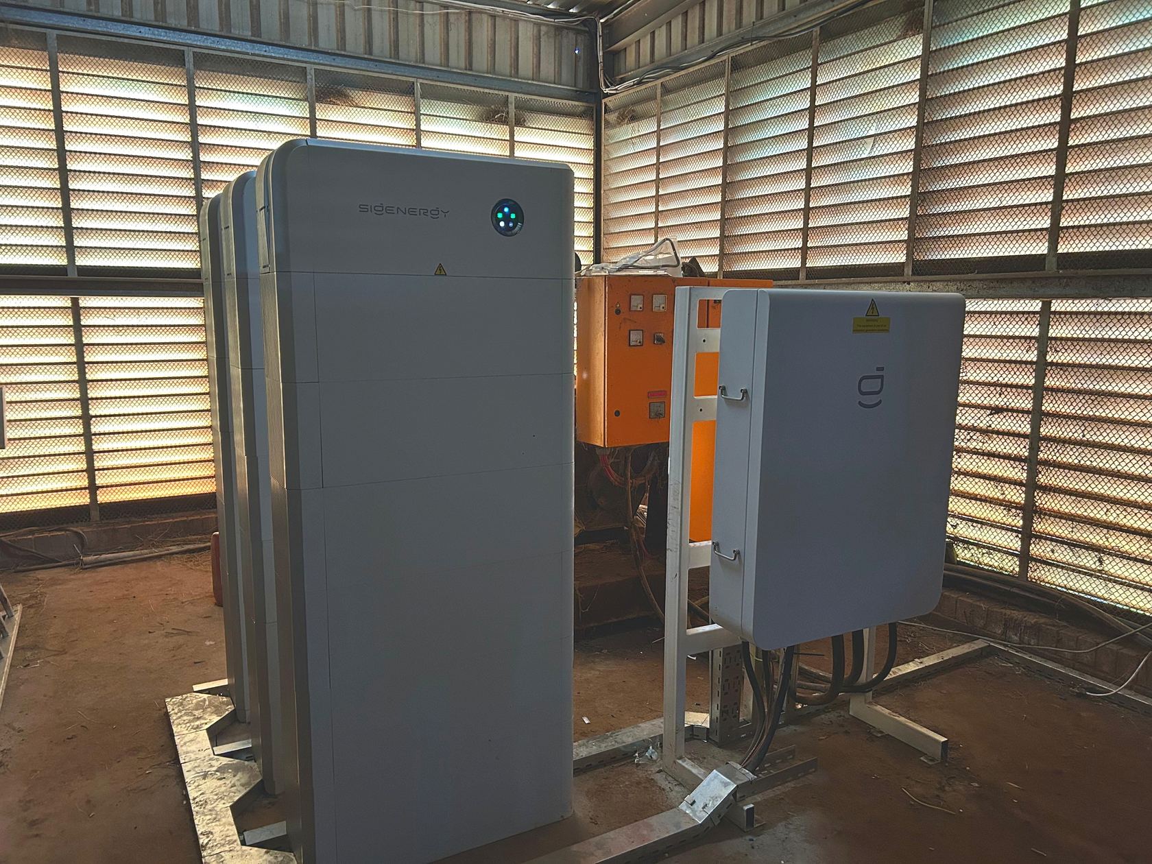 Three Sigenergy SigenStor stacks and gateway cabinet forming the 75 kW / 162 kWh hybrid system at DB Dairy.